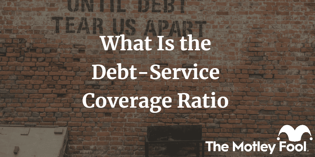 Wall that says until debt tea us apart with the text “What Is the Debt-Service Coverage Ratio” and The Motley Fool jester cap logo