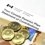 A Canada Pension Plan Statement of Contributions with a 100 dollar banknote and dollar coins.