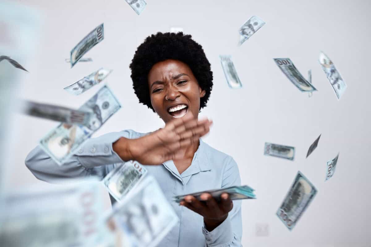 happy woman throws cash