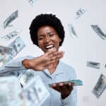 happy woman throws cash