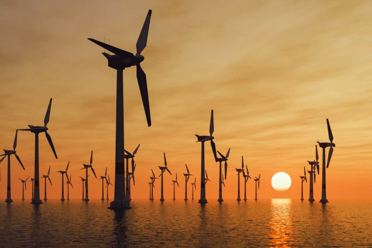 Offshore wind turbine farm at sunset