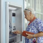 customer uses bank ATM