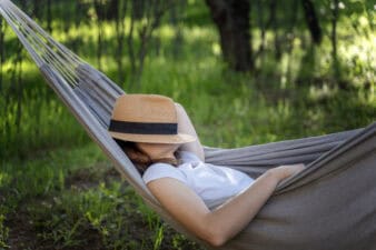 resting in a hammock with eyes closed