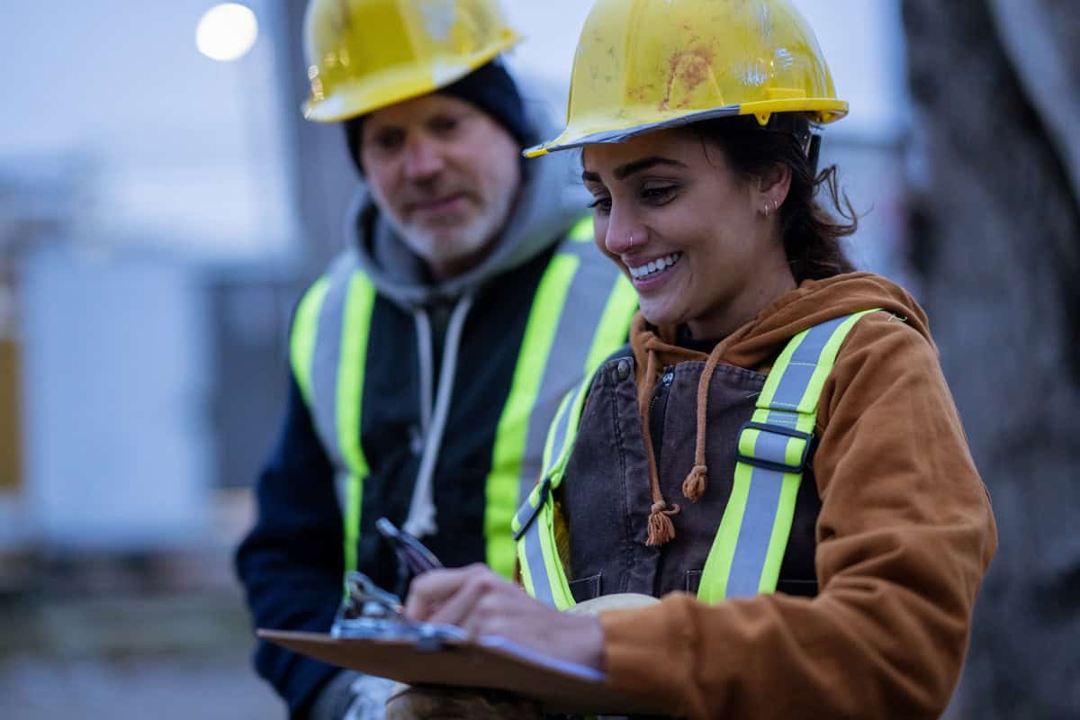 construction workers talk on the job site