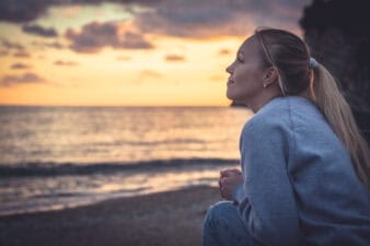 woman looks out at horizon