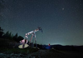 oil pump jack under night sky