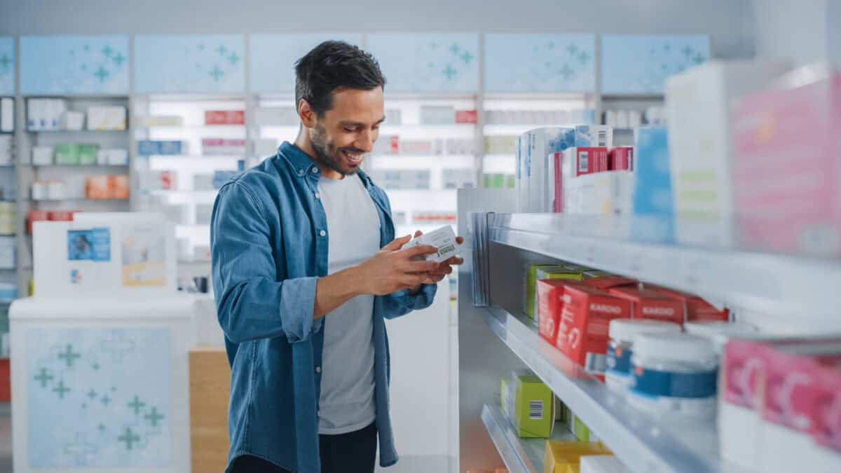 man shops in a drugstore