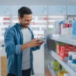 man shops in a drugstore