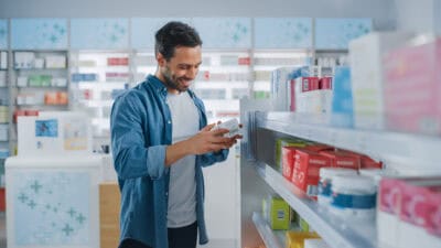 man shops in a drugstore