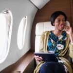 Woman in private jet airplane