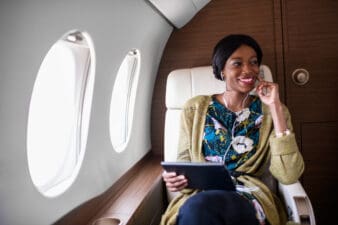 Woman in private jet airplane